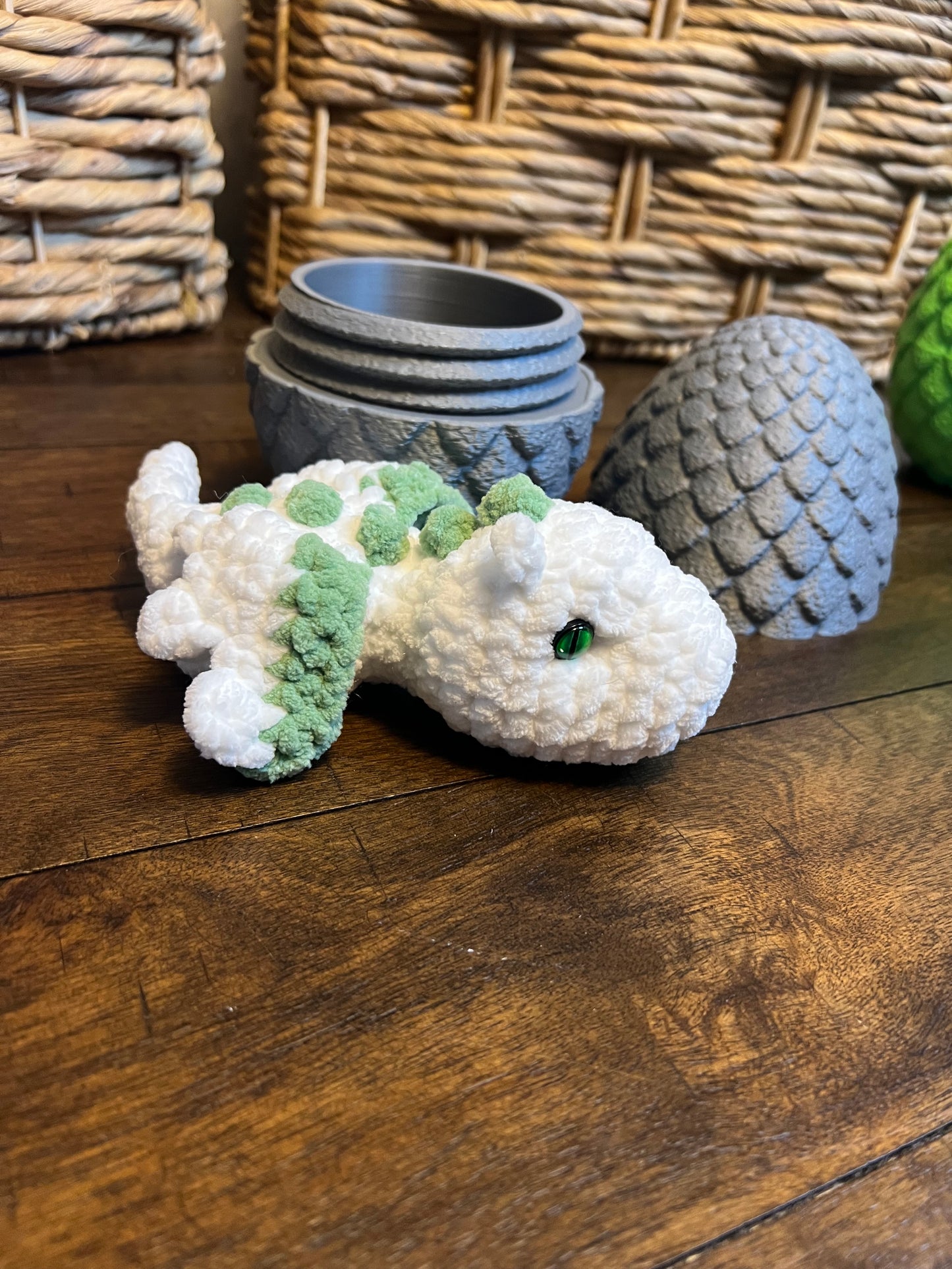 Gray dragon egg with white baby dragon